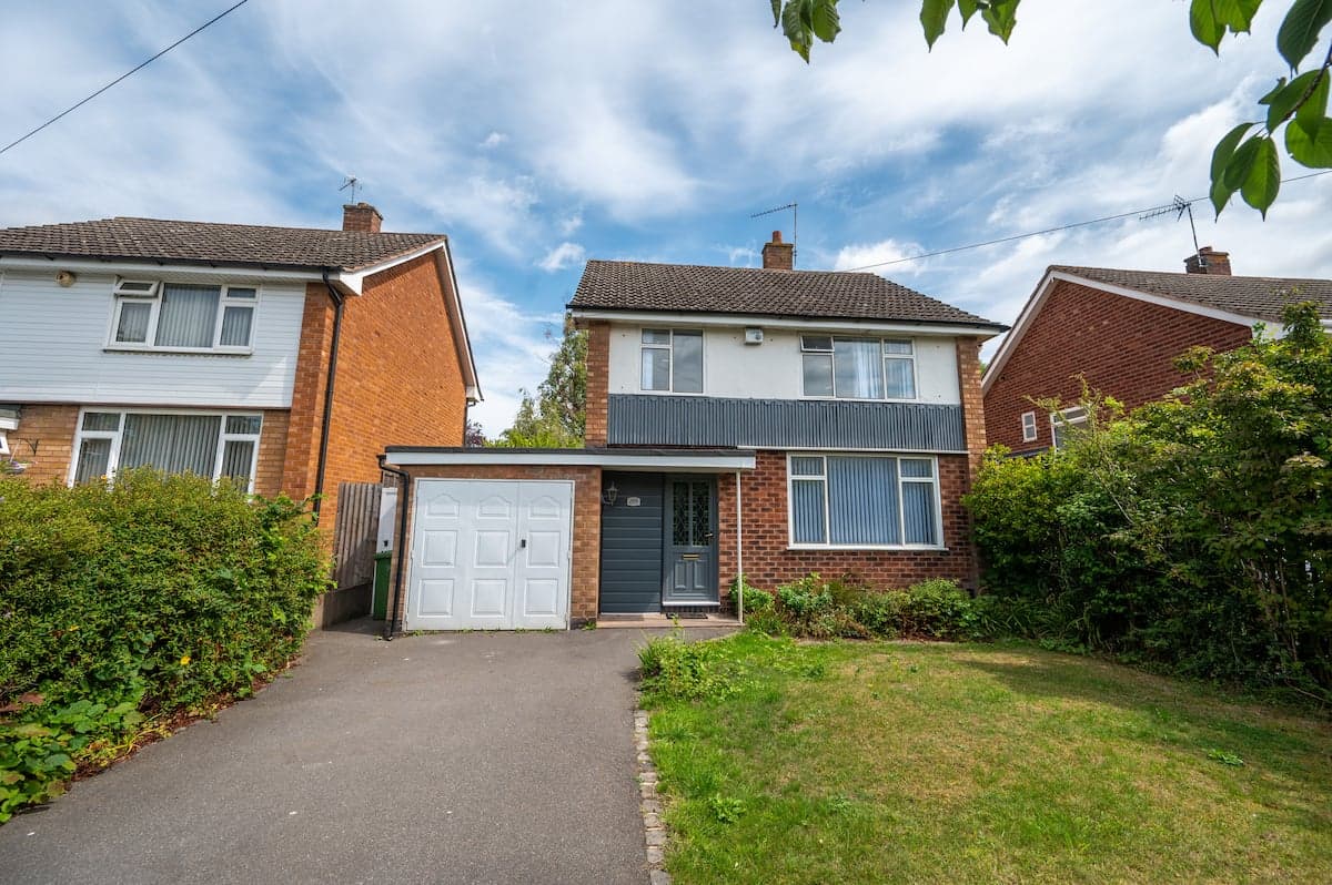 Front exterior of a Mayra Housing three-bedroom house in Shirley, Solihull, with driveway parking